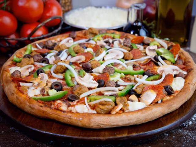 Supreme pizza from the current Delish Pizza menu